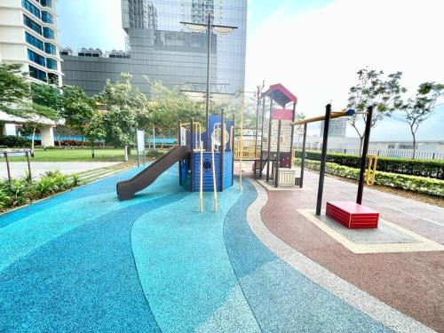 a playground with a slide in a park at I Cozy home 1-5pax Setia Alam Trefoil Wifi TV SCCC in Setia Alam