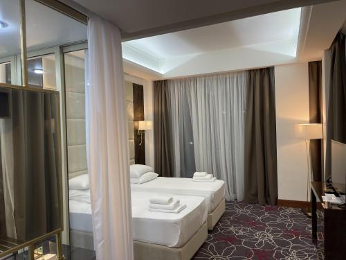 חדר רחצה ב-Grand Hotel Sukhum Resorts