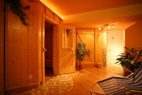 a hallway with a door and plants in a room at Haus Alpenglühn in Schladming