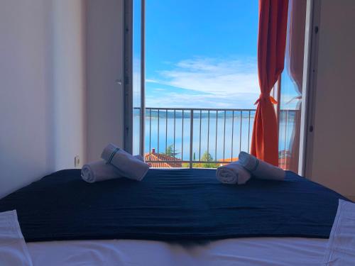 Postel nebo postele na pokoji v ubytování Apartments Julija