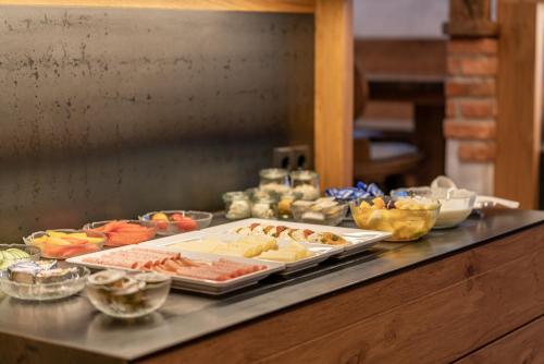 a buffet with many different types of food on a counter at Heiners in Sölden