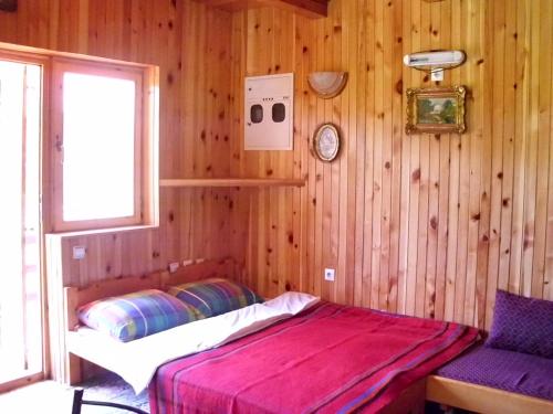 A bed or beds in a room at Apartment Vujisic