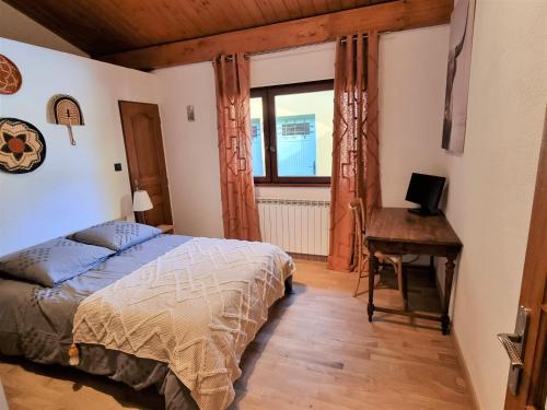 Posteľ alebo postele v izbe v ubytovaní Le Chalet