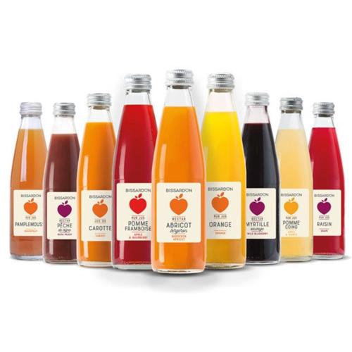 a row of bottles of juice on a shelf at L'Orée des Sources in Volvic