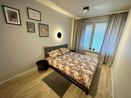 Postel nebo postele na pokoji v ubytování Liepu Apartments Druskininkai