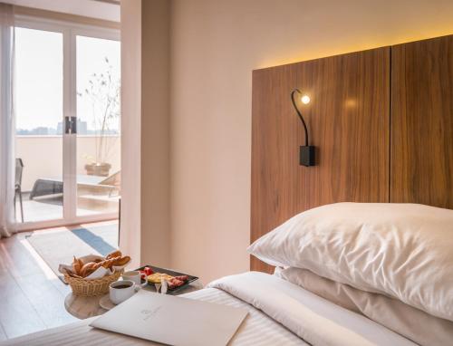 a bedroom with a bed with a wooden head board at The President Hotel Cairo in Cairo