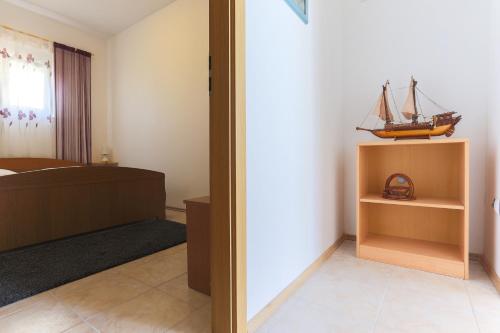 Ένα ή περισσότερα κρεβάτια σε δωμάτιο στο Apartment Ema