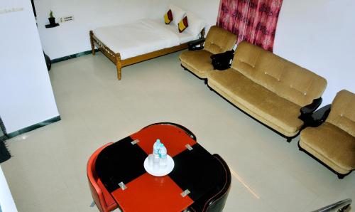 Zona de estar de TGT Holidays Yercaud