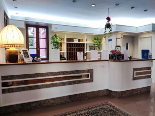 a lobby of a hotel with a reception counter at Hotel Il Castello in Pozzolengo