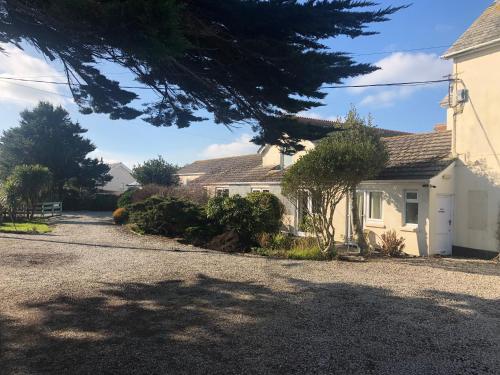 a house with a driveway in front of it at Southcote Accommodation in Tintagel