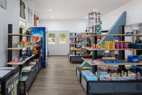 a store aisle with shelves of toys and other items at Sun Outdoors North Moab in Moab