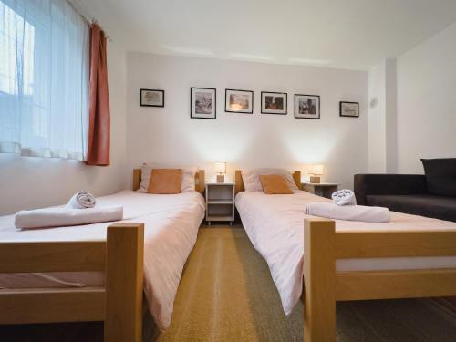 מיטה או מיטות בחדר ב-Apartman Lokum