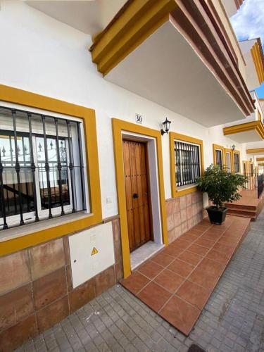 a house with a front door and a patio at Apartamento ANY in Benaoján