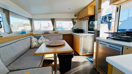 a kitchen with a couch and a table in a caravan at Croatia by Luxury Catamaran in Split