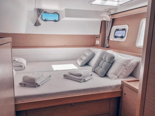 a bed in the back of a boat with towels at Croatia by Luxury Catamaran in Split