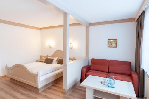 Postel nebo postele na pokoji v ubytování Hotel Eisensteiner Hof
