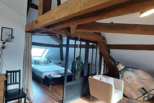 a bedroom with a bed and a mirror in a room at *NEW*Les Amandines le LOFT* WIFI in Allevard