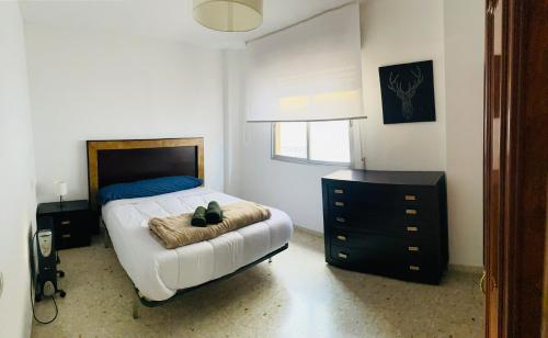 Кровать или кровати в номере Alhambra Apartments