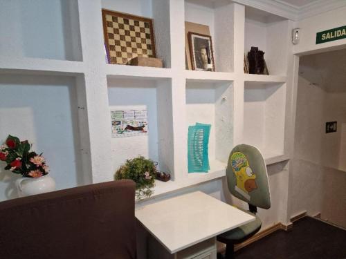 a office with a desk and a chair in a room at APARTAMENTO MADRID Norte in San Sebastián de los Reyes