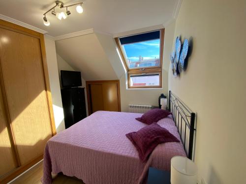 En eller flere senge i et værelse på Ático Rey Daviña Centro y Playa