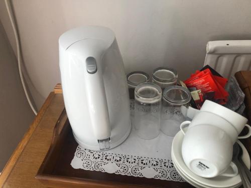 a white mixer sitting on top of a table at Southcote Accommodation in Tintagel