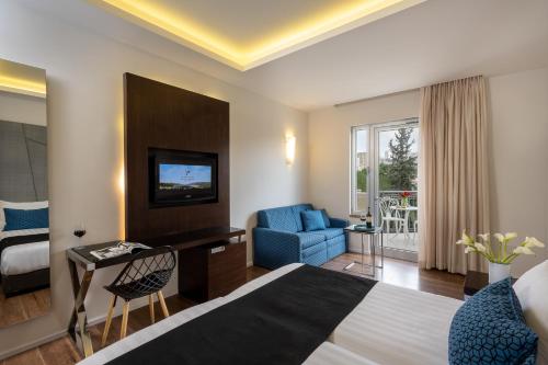 Postel nebo postele na pokoji v ubytování Hotel Yehuda
