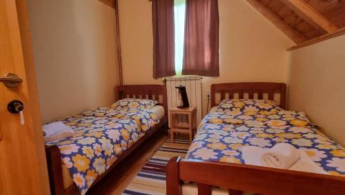 Postel nebo postele na pokoji v ubytování Jankovic Chalet