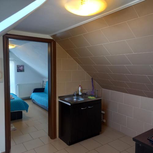 a bathroom with a sink and a mirror at Charter Apartments Costea in Sibiu