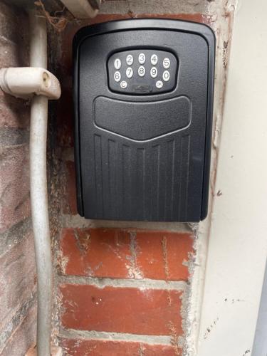 a soap dispenser on the side of a brick wall at Appelscha aan de diek in Appelscha