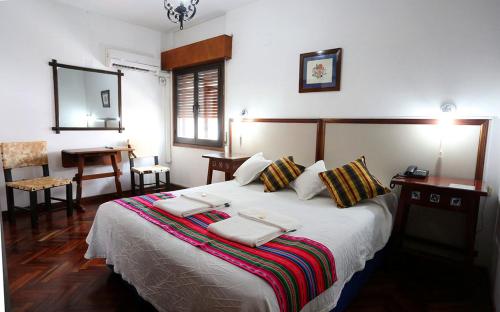 Кровать или кровати в номере Hotel Regidor