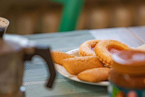 a plate of onion rings on a table at Affitti Brevi Toscana - Ospitalità in Campagna in Talamone