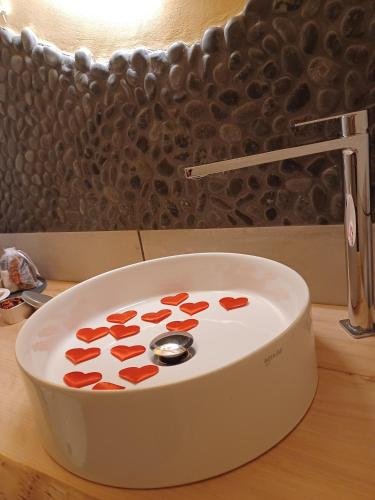 a white bowl with hearts on it on a counter at Domus Duomo B&B Napoli in Naples