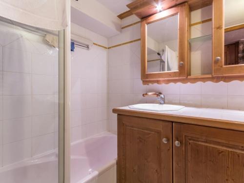 a bathroom with a sink and a tub and a shower at Appartement Les Arcs 1800, 3 pièces, 6 personnes - FR-1-346-348 in Arc 1800