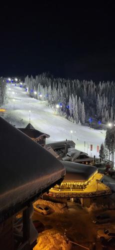 a view of a ski resort at night at Apartment 533 in Aparthotel Vucko Jahorina - Private host in Jahorina