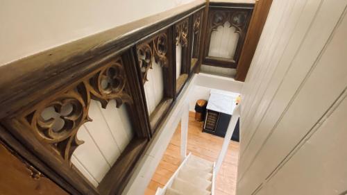 an overhead view of a stairway with a railing at SPINDRIFT is A Beautiful Newly Refurbished THREE BEDROOM Private Family House located on the OLD HARBOUR and the COASTAL PATH in the Heart of Beautiful POLPERRO in Polperro