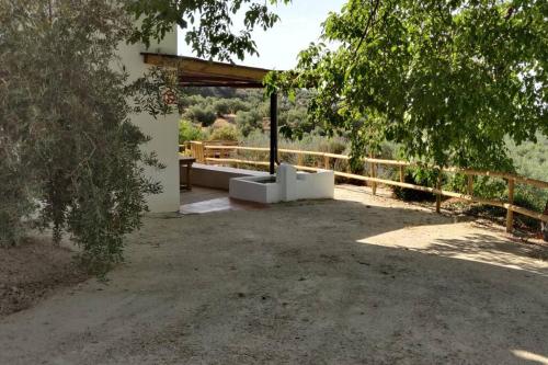 a building with a pavilion in the middle of a yard at Alojamiento Encarnación in Torres