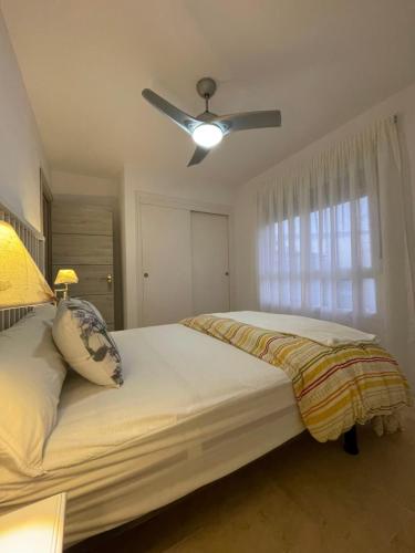 En eller flere senge i et værelse på Apartamento El Portil, Pinares