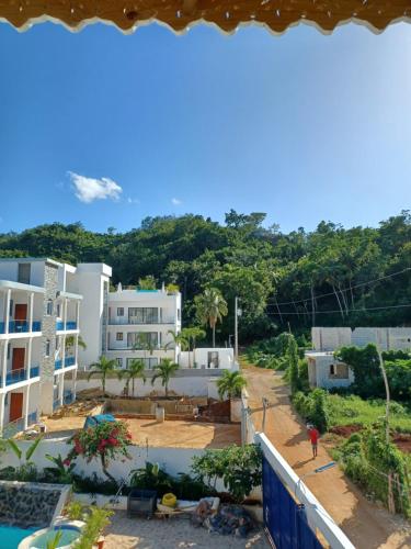 a view from the balcony of a building at Doña Mayra Aparta Hotel in Las Terrenas
