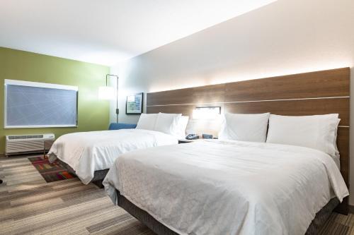 a hotel room with two beds and a window at Holiday Inn Express & Suites - Moundsville by IHG in Moundsville