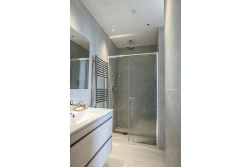a bathroom with a shower and a sink at 360 Nicosia - Luxury Apartment Panoramic View in Nicosia