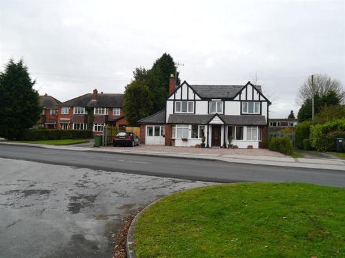 a house on the side of a street at Achill Guest House in Solihull