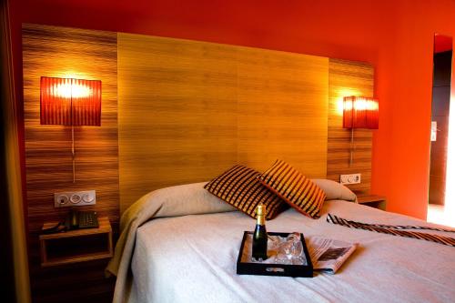 Hotel Spa QH Centro Leónにあるベッド