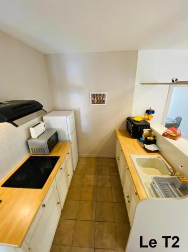 a kitchen with a sink and a counter top at Kasa Créole in Les Trois-Îlets