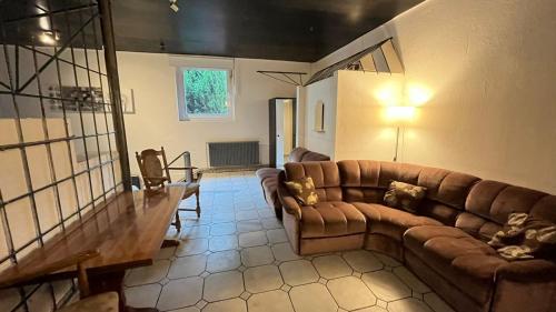 a living room with a couch and a table at Haus Luise ideal Monteure in Delmenhorst