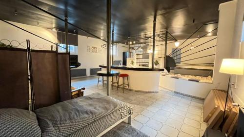 a bedroom with a bed and a kitchen with a table at Haus Luise in Delmenhorst