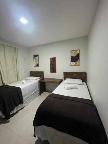 a room with two beds in a room at Apartamento no Condomínio Sonhos da Serra - Bananeiras in Bananeiras