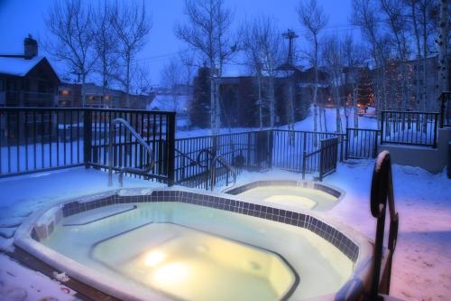 a jacuzzi tub in a snow covered yard at La Casa in Steamboat Springs