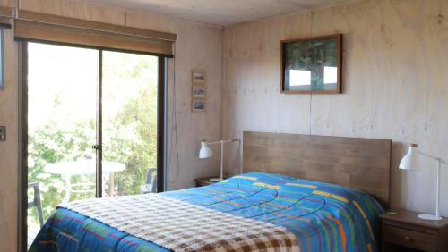 Postel nebo postele na pokoji v ubytování Cabanas Viento Sur. Los Vilos