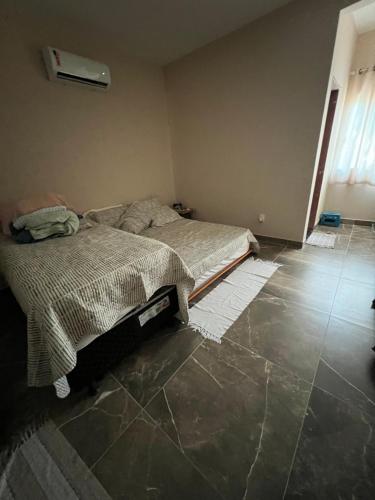 Un pat sau paturi într-o cameră la Dw suites Barra Grande Bahia