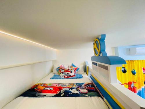 a lego room with two beds with cars on them at 芹菜芋頭親子民宿 in Taitung City